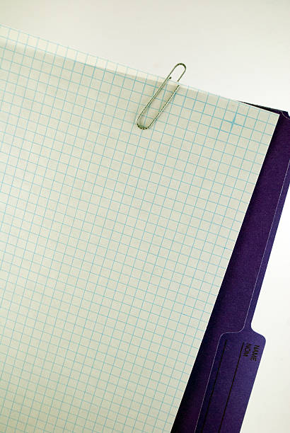 Graph Paper and Folder Graph paper clipped to a manila folder on a white background ... with copy space. manila folder and paper clip stock pictures, royalty-free photos & images