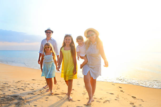 istock Happy young family have fun on beach 1164523976