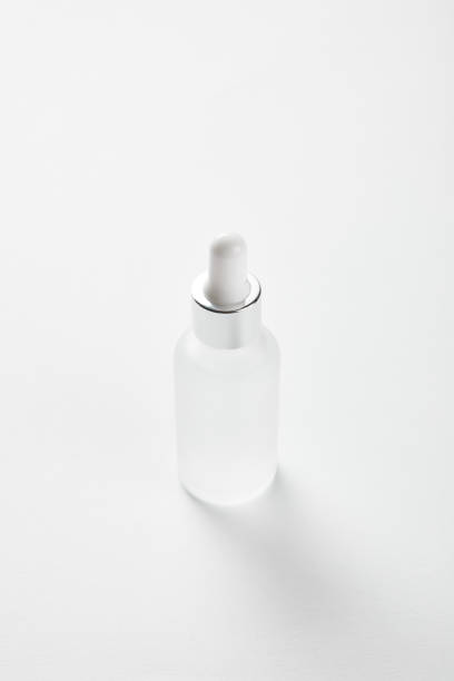 istock cosmetic glass bottle with serum on white 1164524314