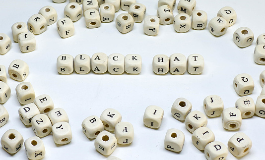 online marketing term on white background wooden abc black hat