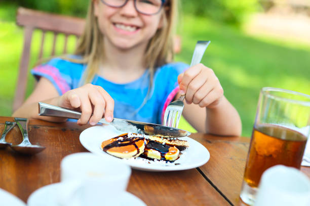 Pancakes om a red plate isolated Over Black