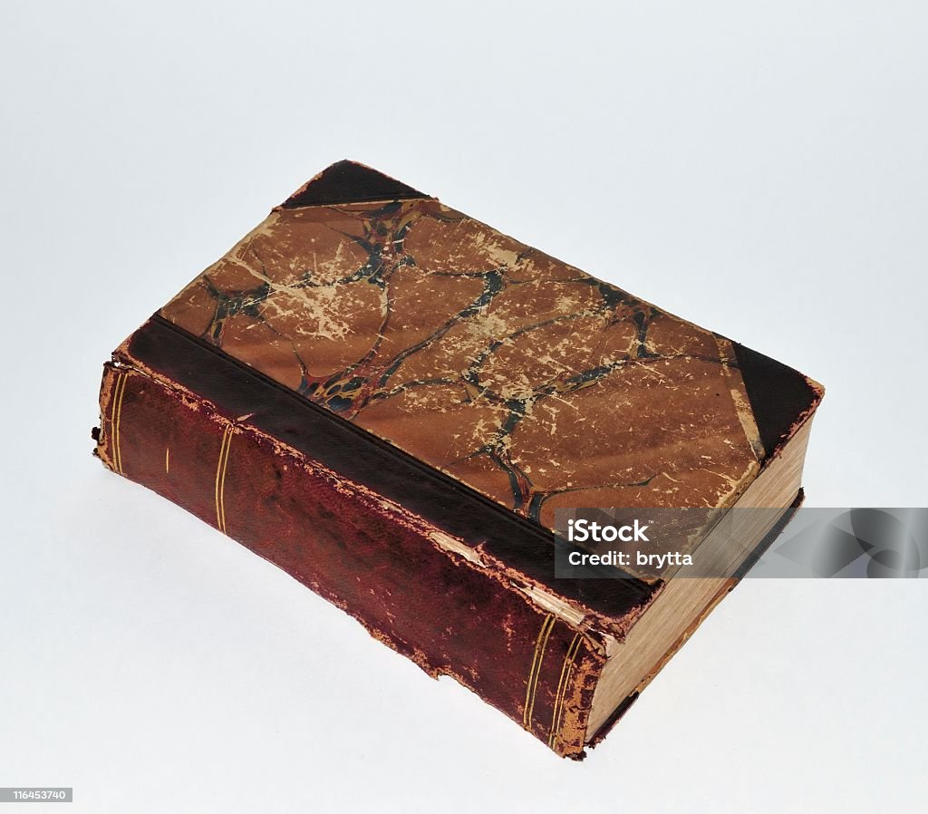 Very old book Close-up of a 150 year old book with leather book spine on a white background. Ancient Stock Photo