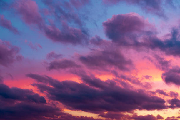 istock Cloudy sky on sunset with blue and yellow colors. 1164538725