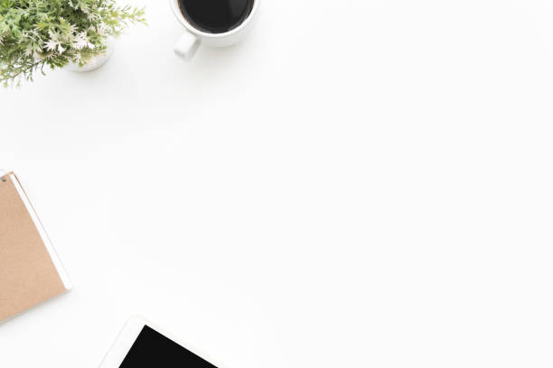 istock White office desk table with office supplies. Top view with copy space, flat lay. 1164539637