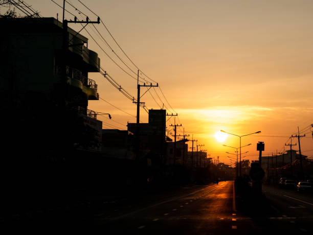 The Sun Rises behind The City Streets in The Morning
