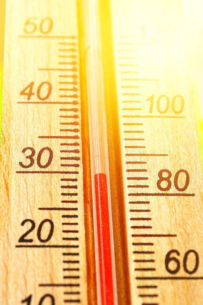 istock Thermometer displaying high 30 degree hot temperatures in sun summer day. 1164541166