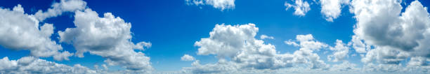 istock panorama of white clouds in a blue sky 1164542251