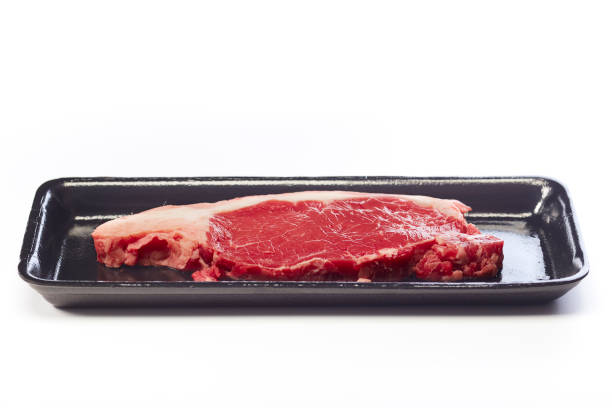 istock raw beef steak in vacuum package on white background 1164542407