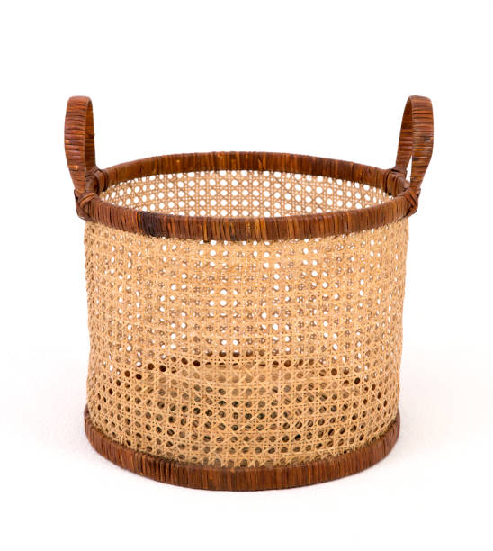 istock Big rush mat round basket with handles on white isolated background 1164544720