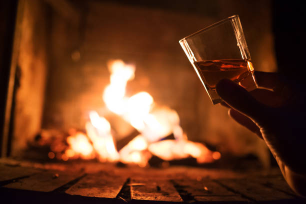 istock Whiskey glass with bonfire background crop 1164545756