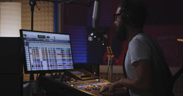 istock Man recording his own voice part in studio 1164554757