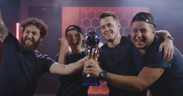 istock Gaming tournament team celebrating their victory 1164554776
