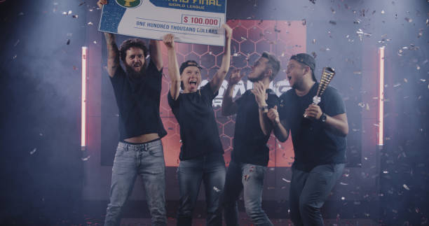 istock Gaming tournament team celebrating their victory 1164554854