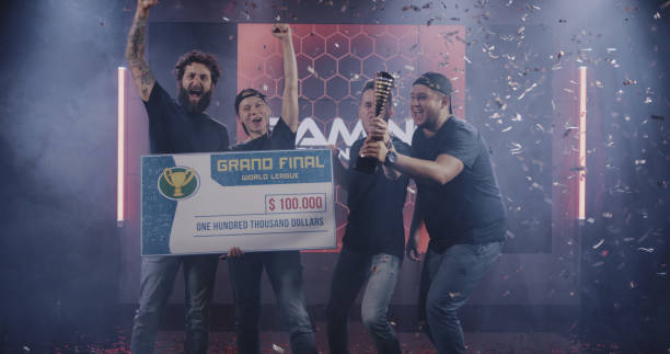istock Gaming tournament team celebrating their victory 1164554874
