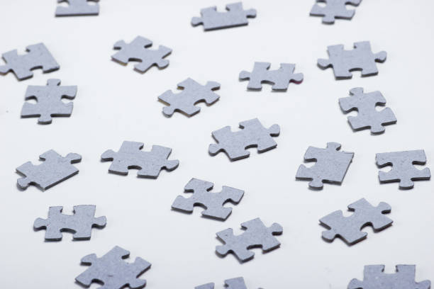 istock Many elements of a puzzle on a white background 1164560771