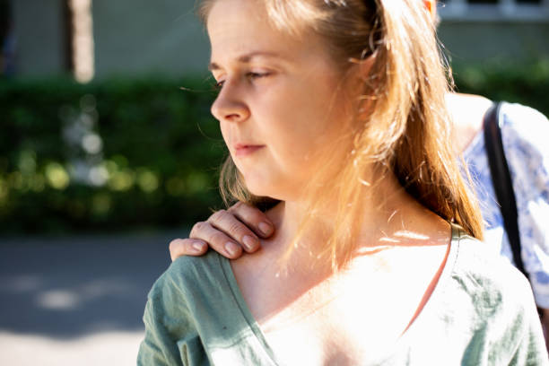 istock Elder woman’s hand on a teen’s shoulder 1164560842