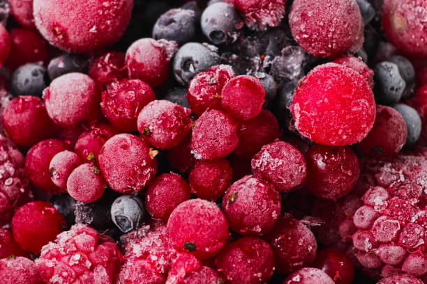 istock Frozen berries closeup. Cherries, currants, blueberries, blackberries