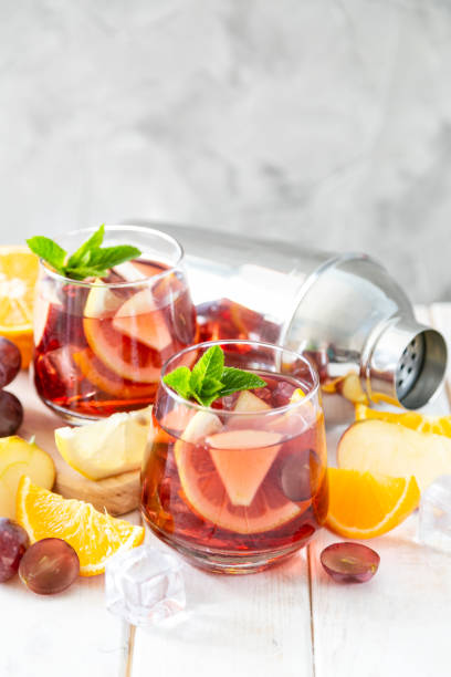 istock Sangria and ingredients in glasses on wood background 1164562796
