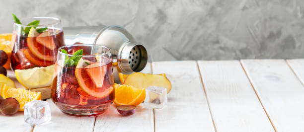istock Sangria and ingredients in glasses on wood background 1164562800