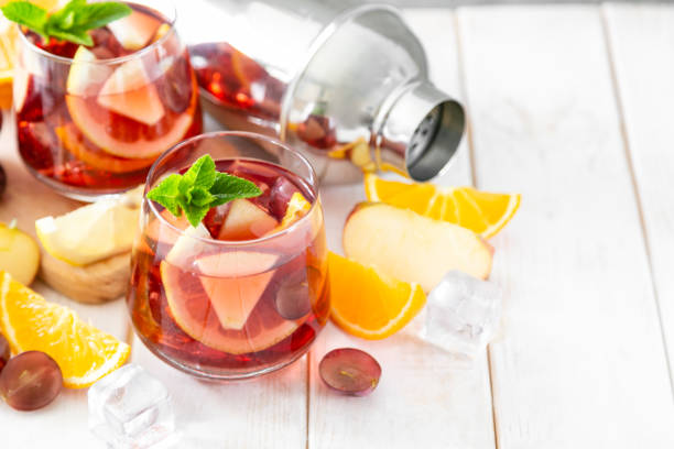 istock Sangria and ingredients in glasses on wood background 1164562809