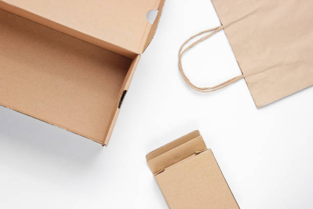 istock Eco concept. Cardboard boxes, paper bag on a white background. Top view 1164563274