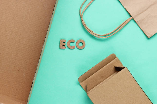 istock Eco concept. Cardboard boxes, paper bag on blue background. Top view 1164563323