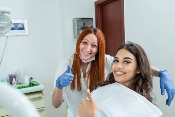 istock Doctor and Patient After Successful Dental Treatment 1164564892