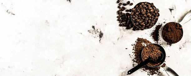 istock Coffee concept - beans, ground, instant, capsules, marble background 1164565964