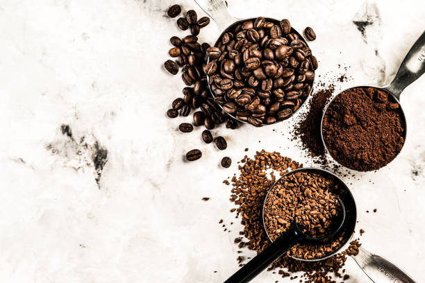 istock Coffee concept - beans, ground, instant, capsules, marble background 1164565987