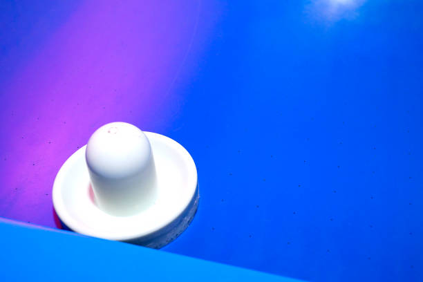 istock Bright and brilliant air hockey table with instruments for playing. 1164567570