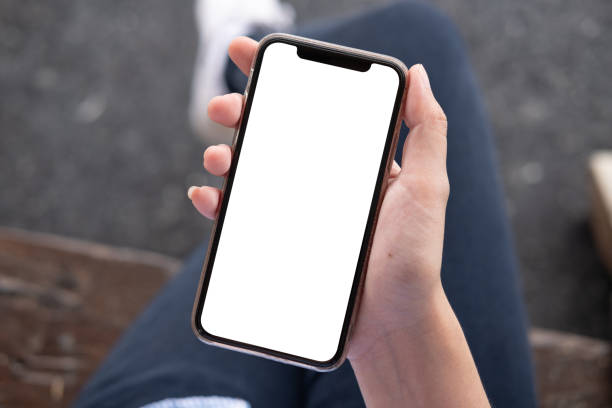 istock woman using Smartphone. Blank screen mobile phone for graphic display montage.networking service. 1164570650