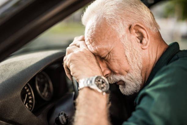 istock Senior man leaning on a steering wheel after a car accident. 1164572127