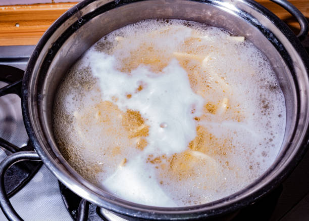 Pot with pasta boiling stock photo