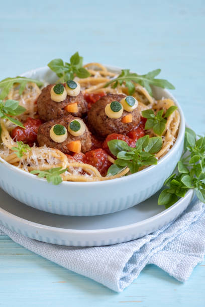 istock Pasta spaghetti with funny meatballs for kids 1164575662