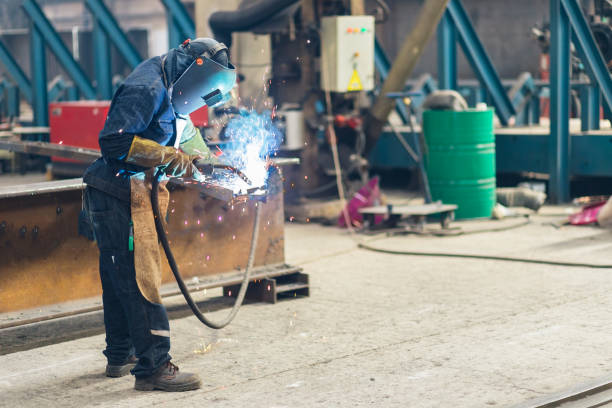 istock Welder works in an industrial company 1164580548