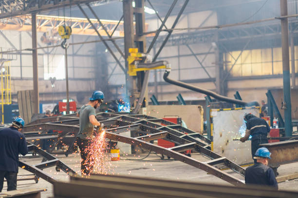 istock using electric grinder in metal industry 1164582303