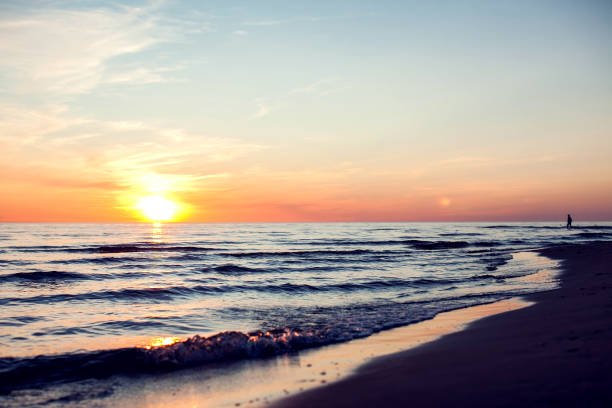 istock A sunset on the beach. Sea and eveninig sky with clouds 1164584139