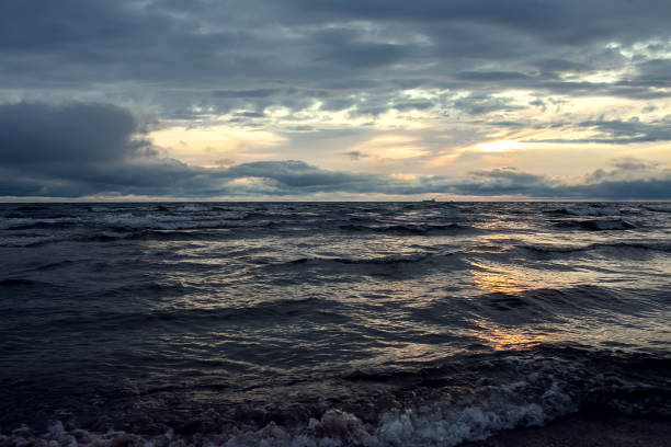 istock A sunset on the beach. Sea and eveninig sky with clouds 1164584197