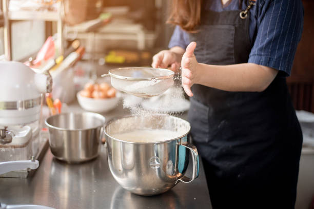 istock Beautiful woman is making bakery 1164584362