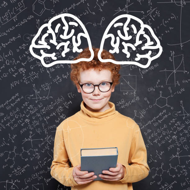 istock Happy smart school boy with ginger hair on science background. Learn science and science power concept 1164584370
