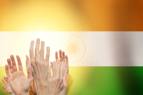 istock People raising hands and flag India on background. Patriotic con 1164585315