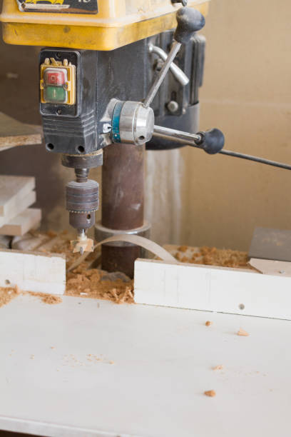 istock Boring machine with nozzle in the furniture workshop, selective focus 1164586097