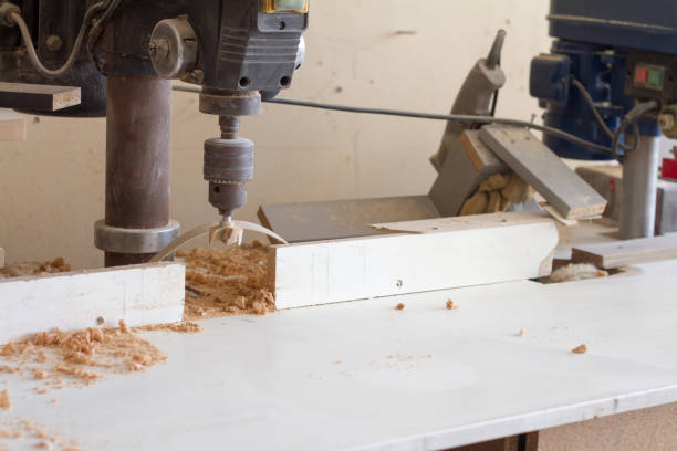 istock Boring machine with nozzle in the furniture workshop, selective focus 1164586170
