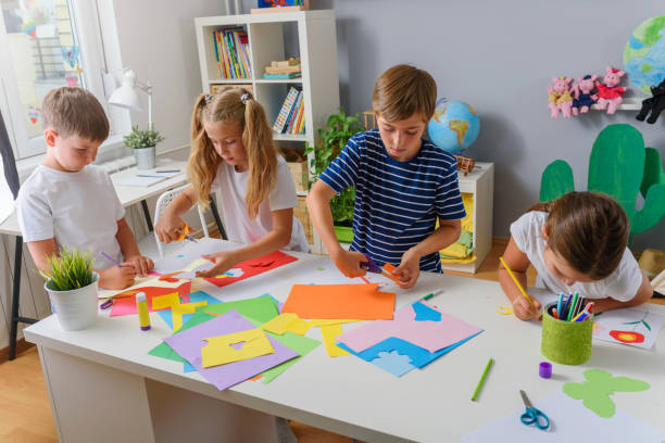 Creative kids making some paper arts and crafts