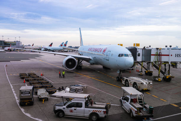 an air canada boeing airplane is being prepared to depart from toronto pearson international airport (yyz) - depart imagens e fotografias de stock