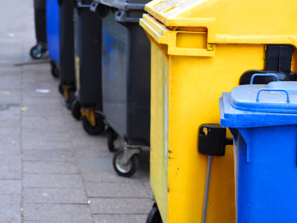 istock Multicolored trash cans on the street 1164589633