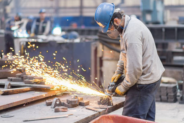 istock using electric grinder in metal industry 1164593013