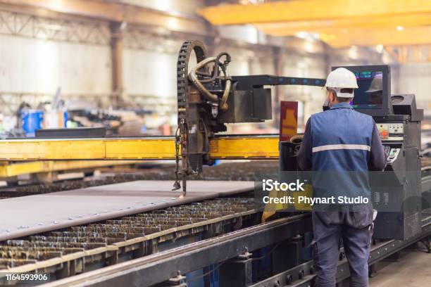 Steel Worker On Cnc Plasma Cutter Machine Stock Photo - Download Image Now - Manufacturing, Factory, Industry