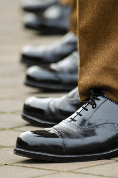 istock Soldiers in uniform with highly polished shoes 1164596478