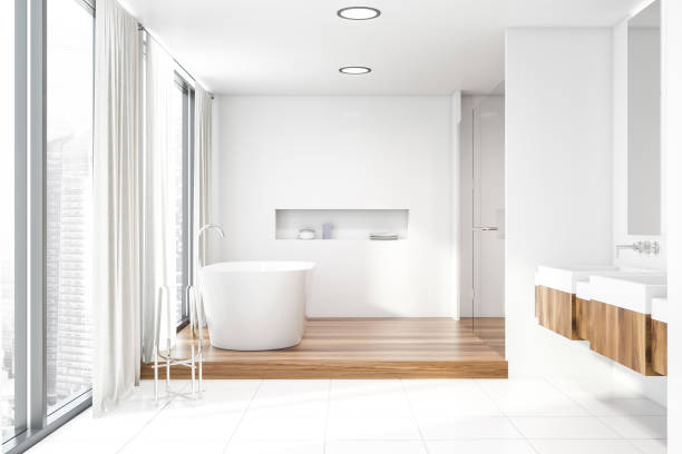 istock White bathroom with double sink and tub 1164596486